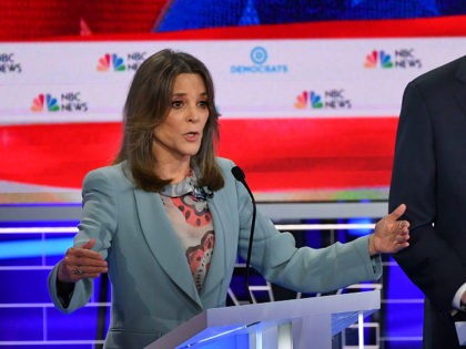 Democratic presidential hopefuls US author and writer Marianne Williamson (L) and Former Governor of Colorado John Hickenlooper (R) participate in the second Democratic primary debate of the 2020 presidential campaign season hosted by NBC News at the Adrienne Arsht Center for the Performing Arts in Miami, Florida, June 27, 2019. …