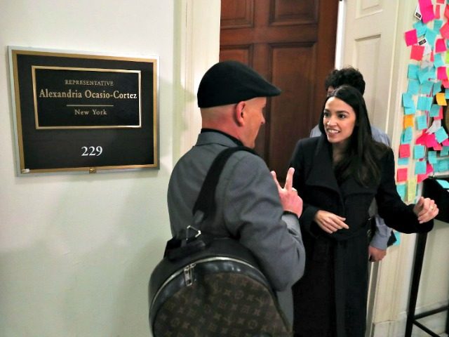 Rep. Alexandria Ocasio-Cortez (D-NY) speaks to a supporter outside of her office in the Cannon House Office Building on Capitol Hill February 14, 2019 in Washington, DC. (Mark Wilson/Getty Images/AFP)