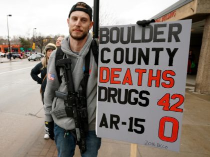 BOULDER, CO - APRIL 21: A man who didn't want to be identified carries his Noveske N4 300 Blackout AR-15 pistol at a pro gun rally on April 21, 2018 in Boulder, Colorado. The city of Boulder is considering enacting an ordinance that will ban the sale and possession of …