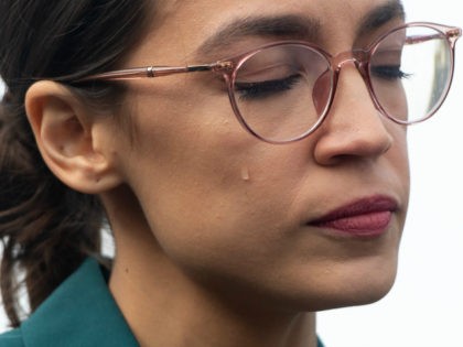 US Representative Alexandria Ocasio-Cortez, Democrat of New York, sheds a tear during a pr