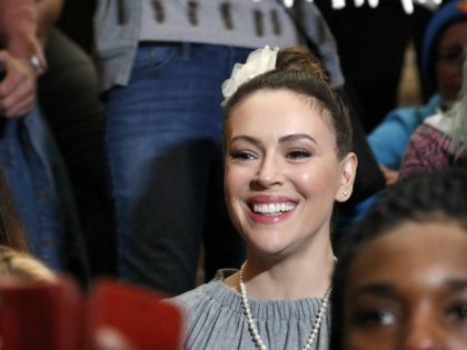Actress Alyssa Milano, front right, poses with film industry workers and pro-abortion righ