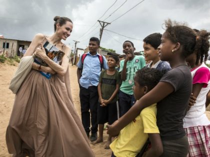 RIOHACHA, COLOMBIA - JUNE 07: (EDITORIAL USE ONLY) In this handout image provided by United Nations High Commission for Refugees, UNHCR Special Envoy Angelina Jolie speaks with children in Riohacha, Colombia, on June 7, 2019. Jolie visited the children, who had fled Venezuela, in Brisas del Norte, an informal settlement …