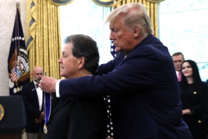 President Donald Trump awards the Presidential Medal of Freedom to economist Arthur Laffer, Wednesday, June 19, 2019, in the Oval Office of the White House in Washington. (AP Photo/Jacquelyn Martin)