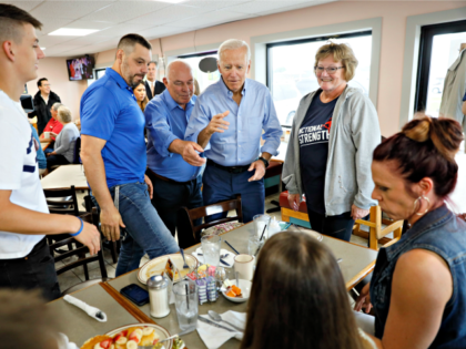 Democratic presidential candidate former Vice President Joe Biden visits with local diners during a stop at the Tasty Cafe, Wednesday, June 12, 2019, in Eldridge, Iowa. (AP Photo/Charlie Neibergall)