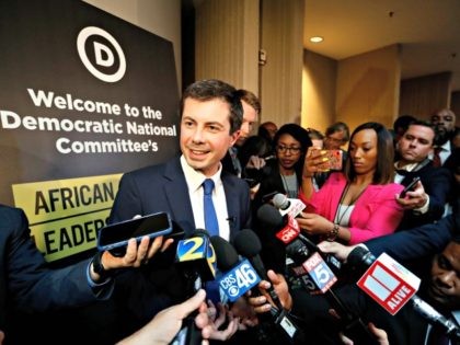 Democratic presidential candidate Pete Buttigieg talks with reporters after addressing the African American Leadership Summit Thursday, June 6, 2019, in Atlanta. (AP Photo/John Bazemore)