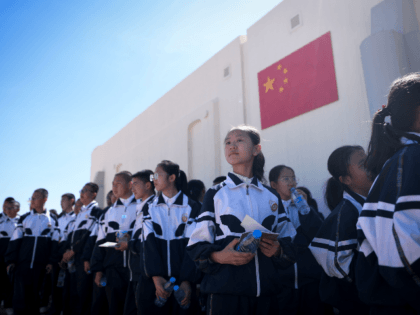 A group of students visit "Mars Base 1", a C-Space Project, in the Gobi desert, some 40 kilometres from Jinchang in China's northwest Gansu province on April 17, 2019. - Surrounded by barren hills in northwest Gansu province, "Mars Base 1" opened to the public on April 17 with the …