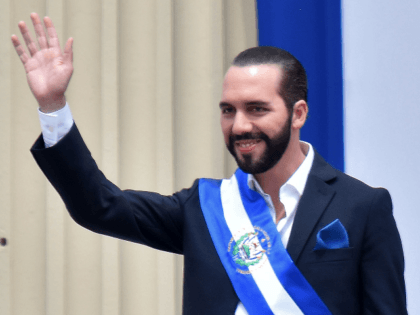 Salvador's new president, Nayib Bukele, waves during his inauguration ceremony at Gerardo Barrios Square outside the National Palace in downtown San Salvador, on June 1, 2019. - Bukele, 37, who was elected in February to succeed Salvador Sanchez Ceren, has said he will seek closer ties with the United States, …