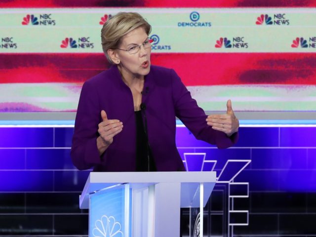 MIAMI, FLORIDA - JUNE 26: Sen. Elizabeth Warren (D-MA) and former Texas congressman Beto O'Rourke take part in the first night of the Democratic presidential debate on June 26, 2019 in Miami, Florida. A field of 20 Democratic presidential candidates was split into two groups of 10 for the first …