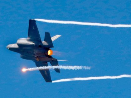An Israeli F-35 fighter jets performs during an air show, over the beach in the Mediterran
