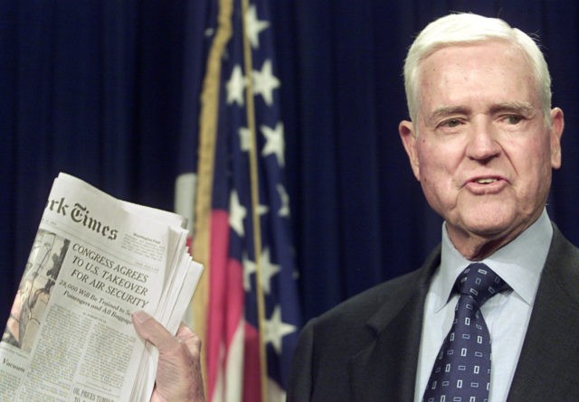 WASHINGTON, : Senator Ernest Hollings, D-SC, holds up a copy of the New York Times after the Senate voted to pass the airline security bill 16 November 2001 on Capitol Hill. A House vote later in the day sends the bill, a product of weeks of negotiations, to US President …