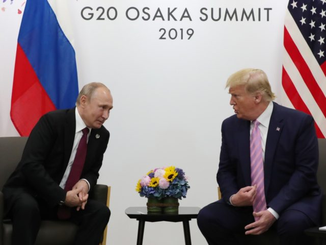 Russian President Vladimir Putin and US President Donald Trump hold a meeting on the sidel