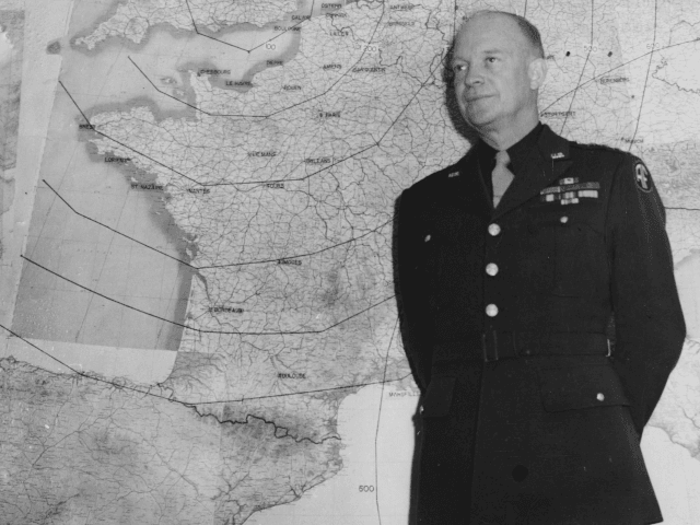 General Dwight Eisenhower standing in front of a large wall map in his office, London, January 17th 1944. (Photo by Keystone/Hulton Archive/Getty Images)