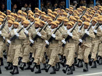 Iranian soldiers march during a military parade as they mark the country's annual army day