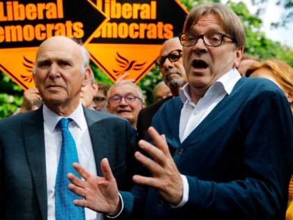 Britain's leader of the Liberal Democrat party, Vince Cable (L) and the European Parliament's chief Brexit negotiator and Leader of the Alliance of Liberals and Democrats for Europe party, Guy Verhofstadt (R) speak to members of the media before canvassing for support for their candidates in the forthcoming European elections, …
