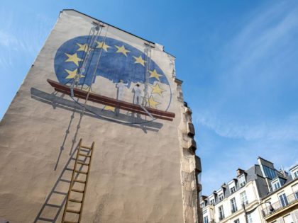 TOPSHOT - A trompe l'oeil shows two workers painting the European Union flag on the side of a building in the French capital Paris on May 23, 2019. - Europe kicked off voting across the continent in a contest in which rising populist forces are hoping to make significant gains, …
