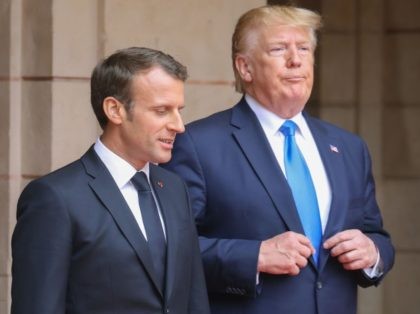 French President Emmanuel Macron (L) speaks with US President Donald Trump ahead of a meeting at the Prefecture of Caen, Normandy, north-western France, on June 6, 2019, on the sidelines of D-Day commemorations marking the 75th anniversary of the World War II Allied landings in Normandy. (Photo by Ludovic MARIN …