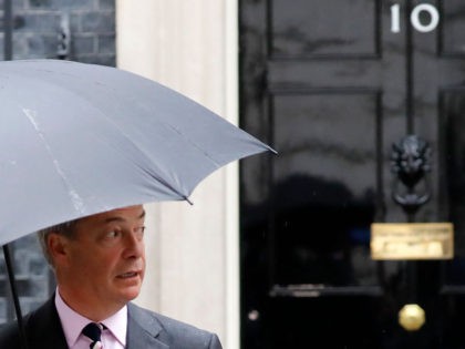 Brexit Party leader Nigel Farage walks away from the door of 10 Downing Street in central