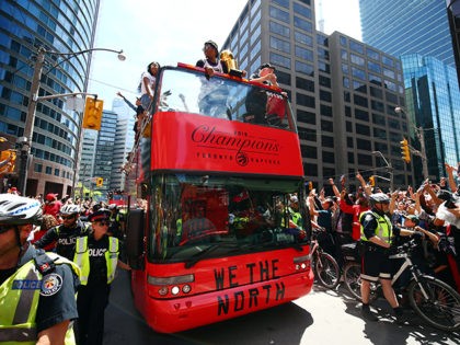 TORONTO, ON - JUNE 17: Kyle Lowry #7 of the Toronto Raptors holds the championship trophy during the Toronto Raptors Victory Parade on June 17, 2019 in Toronto, Canada. The Toronto Raptors beat the Golden State Warriors 4-2 to win the 2019 NBA Finals. NOTE TO USER: User expressly acknowledges …