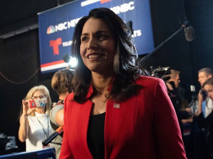 Democratic presidential hopeful US Representative for Hawaii's 2nd congressional district Tulsi Gabbard arrives to the spin room to speak to the press after participating in the first Democratic primary debate of the 2020 presidential campaign season hosted by NBC News at the Adrienne Arsht Center for the Performing Arts in …