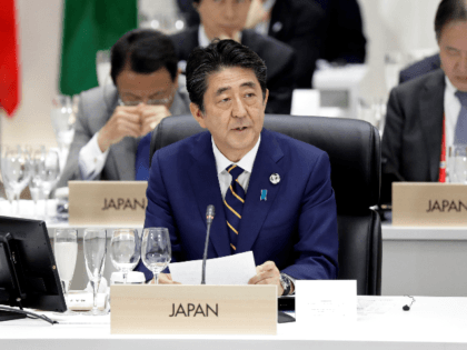 OSAKA, JAPAN - JUNE 28: Shinzo Abe, Japan's prime minister, center, speaks during a working lunch on the first day of the G20 summit on June 28, 2019 in Osaka, Japan. U.S. President Donald Trump arrived in Osaka on Thursday for the annual Group of 20 gathering together with other …