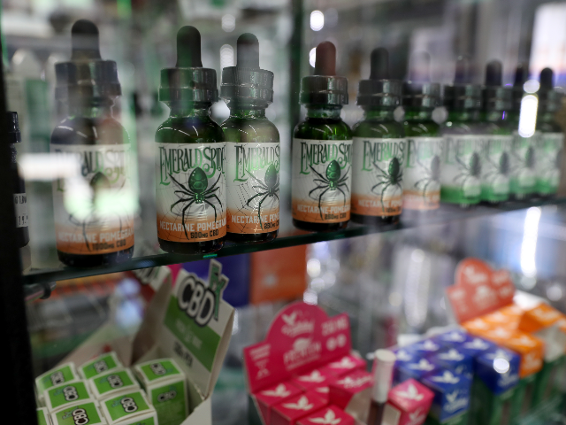 SAN FRANCISCO, CALIFORNIA - JUNE 25: CBD e-juice, used in e-cigarette vaporizers, is displayed at Smoke and Gift Shop on June 25, 2019 in San Francisco, California. The San Francisco Board of Supervisors voted unanimously, 11-0, to be the first city in the United States to ban e-cigarettes, nicotine pods …