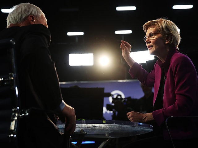 MIAMI, FLORIDA - JUNE 26: Sen. Elizabeth Warren (D-MA) speaks to the media in the spin room following the first night of the Democratic presidential debate on June 26, 2019 in Miami, Florida. A field of 20 Democratic presidential candidates was split into two groups of 10 for the first …