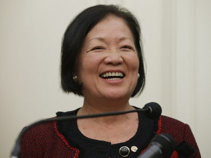 WASHINGTON, DC - MARCH 05: U.S. Sen. Mazie Hirono (D-HI) (L) urges fellow members of Congress to support rising the minimum wage to $10.10 an hour during a news conference at the U.S. Capitol March 5, 2014 in Washington, DC. Citing that nearly two-thirds of those who earn the minimum …