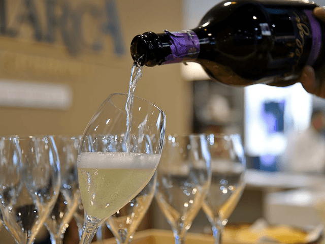 A person poors a glass of Prosecco on April 10, 2016 during the 50th edition of the Vinita