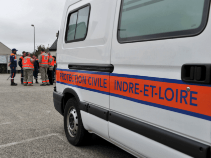 Civil protection rescuers gather as they stay alert in case barriers to stop the flood break as inhabitants of Chapelle-aux-Naux were evacuated following heavy rainfalls, in Vallères, on June 4, 2016. France, Germany and other parts of western and central Europe have been battered by deadly storms and floods over …
