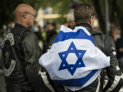 People attend a Taking back Zionism demonstration for Israel on August 28, 2016 at the Raoul Wallenberg Square in Stockholm. About 500 people attended the 5th annual Taking back Zionism manifestation for Israel held in Stockholm. / AFP / JONATHAN NACKSTRAND (Photo credit should read JONATHAN NACKSTRAND/AFP/Getty Images)