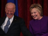 WASHINGTON, DC - DECEMBER 08: Former U.S. Secretary of State Hillary Clinton (R) shares a moment with Vice President Joseph Biden (L) during a leadership portrait unveiling ceremony for Senate Minority Leader Sen. Harry Reid (D-NV) December 8, 2016 on Capitol Hill in Washington, DC. The leadership portrait unveiling ceremony …