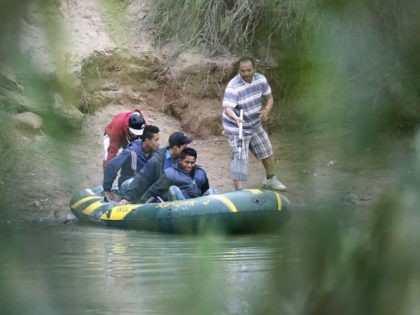 Human Smugglers move migrants across Rio Grande in raft. (File Photo: John Moore/Getty Ima