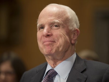 Senator John McCain (R-AZ) looks on during testifying at the Senate Homeland Security and Governmental Affairs Committee hearing on the nomination for General John Kelly, USMC (Ret.) to be Secretary of the Department of Homeland Security, on Capitol Hill on January 10, 2017, in Washington, DC. / AFP / Tasos …