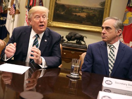 WASHINGTON, DC - MARCH 17: U.S. President Donald Trump (L) delivers remarks during a listening session with Veterans Affairs Secretary David Shulkin (R) and members of several veterans service organizations in the Roosevelt Room at the White House March 17, 2017 in Washington, DC. Saying that he has already heard …