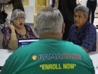 MIAMI, FL - NOVEMBER 01: Isabel Diaz Tinoco (L) and Jose Luis Tinoco speak with Otto Hernandez, an insurance agent from Sunshine Life and Health Advisors, as they shop for insurance under the Affordable Care Act at a store setup in the Mall of Americas on November 1, 2017 in …