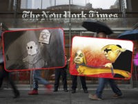 NEW YORK, NY - JUNE 28: Members of the New York City Police Department stand outside the headquarters of The New York Times, June 28, 2018 in New York City. NYPD announced increased security in Manhattan at major media companies following a shooting today at the Capital Gazette newspaper in …