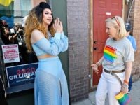 Democratic presidential candidate Kirsten Gillibrand talks with drag queen Vana Rosenberg, left, during the Capital City Pride fest, Saturday, June 8, 2019, in Des Moines, Iowa. (AP Photo/Charlie Neibergall)