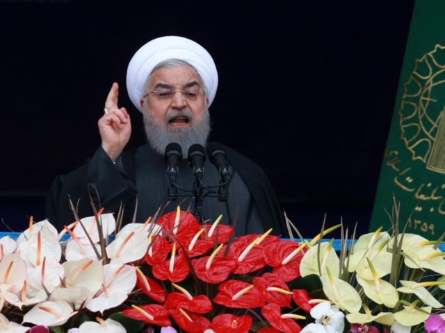 Iranian President Hassan Rouhani speaks during a ceremony celebrating the 40th anniversary of the Islamic Revolution, at the Azadi, Freedom, Square in Tehran, Iran, Monday, Feb. 11, 2019. Speaking from a podium in central Tehran, Rouhani addressed the crowds for nearly 45 minutes, lashing out at Iran's enemies - America …