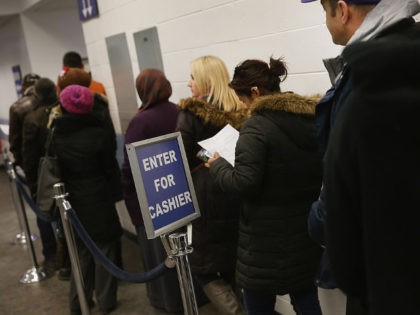 CHICAGO, IL - DECEMBER 10: Illinois residents wait in line at a driver services facility o