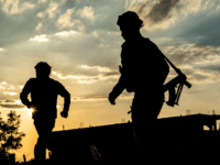 Fighter of the US-backed Syrian Democratic Forces (SDF) walk at a position in the village of Baghouz, near Syria's border with Iraq, in the eastern Deir Ezzor province on March 15, 2019 during the SDF's preparations to advance in the battle against the last pocket of Islamic State group (IS) …