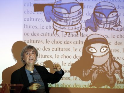 French cartoonist Plantu participates on February 11, 2015 in a workshop with students at the Paul Bert junior high school in the Paris suburb of Malakoff. AFP PHOTO / FRANCOIS GUILLOT (Photo credit should read FRANCOIS GUILLOT/AFP/Getty Images)