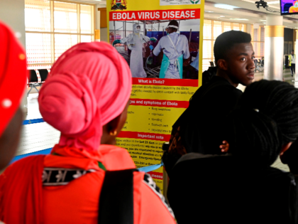 Travellers at the arrival terminal head to be screened by port health service, at the Jommo Kenyatta International airport in Nairobi on June 17, 2019. - Kenya sought to reassure the public and foreign visitors on Monday after a suspected Ebola case, which turned out to be negative, was detected …
