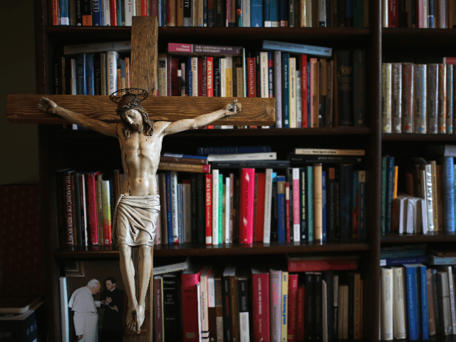 A crucifx leans against religious academic books at Oscott College on May 8, 2014 in Birmi