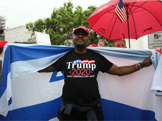 Trump supporters wave a US flag with one wrapped in an Israeli flag as they counter a demo