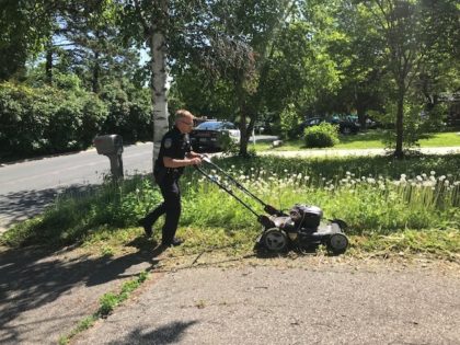 Officer Matt Siltala of the Orono Police Department went to an elderly woman's home to see how she was doing and noticed her yard was in disarray. He then mowed her lawn for her.