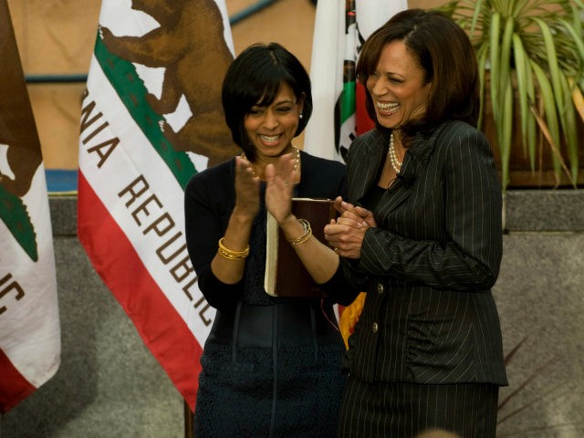 Kamala Harris, right, is inaugurated as attorney general as her sister, Maya Harris, cente