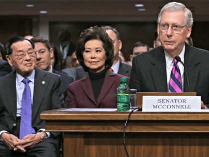 WASHINGTON, DC - JANUARY 11: Senate Majority Leader Mitch McConnell (R-KY) (R) testifies before the Senate Commerce, Science and Transportation Committee on behalf of his wife Elaine Chao (C) during her confirmation hearing to be the next U.S. secretary of transportation as her father Dr. James Chao (L) looks on …