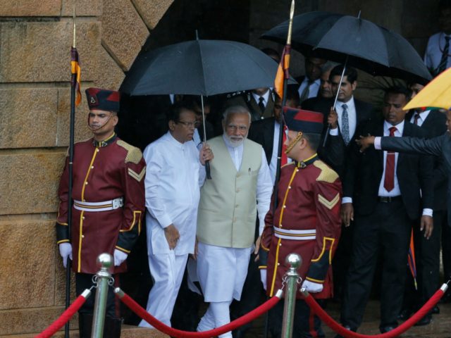 Indian Prime Minister Narendra Modi, center is received by the Sri Lankan President Maithripala Sirisena, center left, upon his arrival at the presidential secretariat in Colombo, Sri Lanka, Sunday, June 9, 2019. Modi arrived in Sri Lanka on Sunday for a brief visit as part of his first overseas tour …