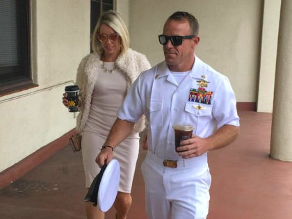 Navy Special Operations Chief Edward Gallagher, right, walks with his wife, Andrea Gallagher as they arrive to military court on Naval Base San Diego, Monday, June 24, 2019, in San Diego. Trial continues in the court-martial of the decorated Navy SEAL, who is accused of stabbing to death a wounded …