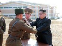 This undated picture released from North Korea's official Korean Central News Agency (KCNA) on November 4, 2016 shows North Korean leader Kim Jong-Un (C) inspecting a special operation battalion under the Korean People's Army (KPA) Unit 525 at an undisclosed location. REPUBLIC OF KOREA OUT / AFP / KCNA / …